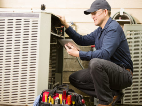 technician working on ac unit scaled e1674508102623
